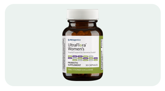 Bottle of UltraFlora Women's on a green background
